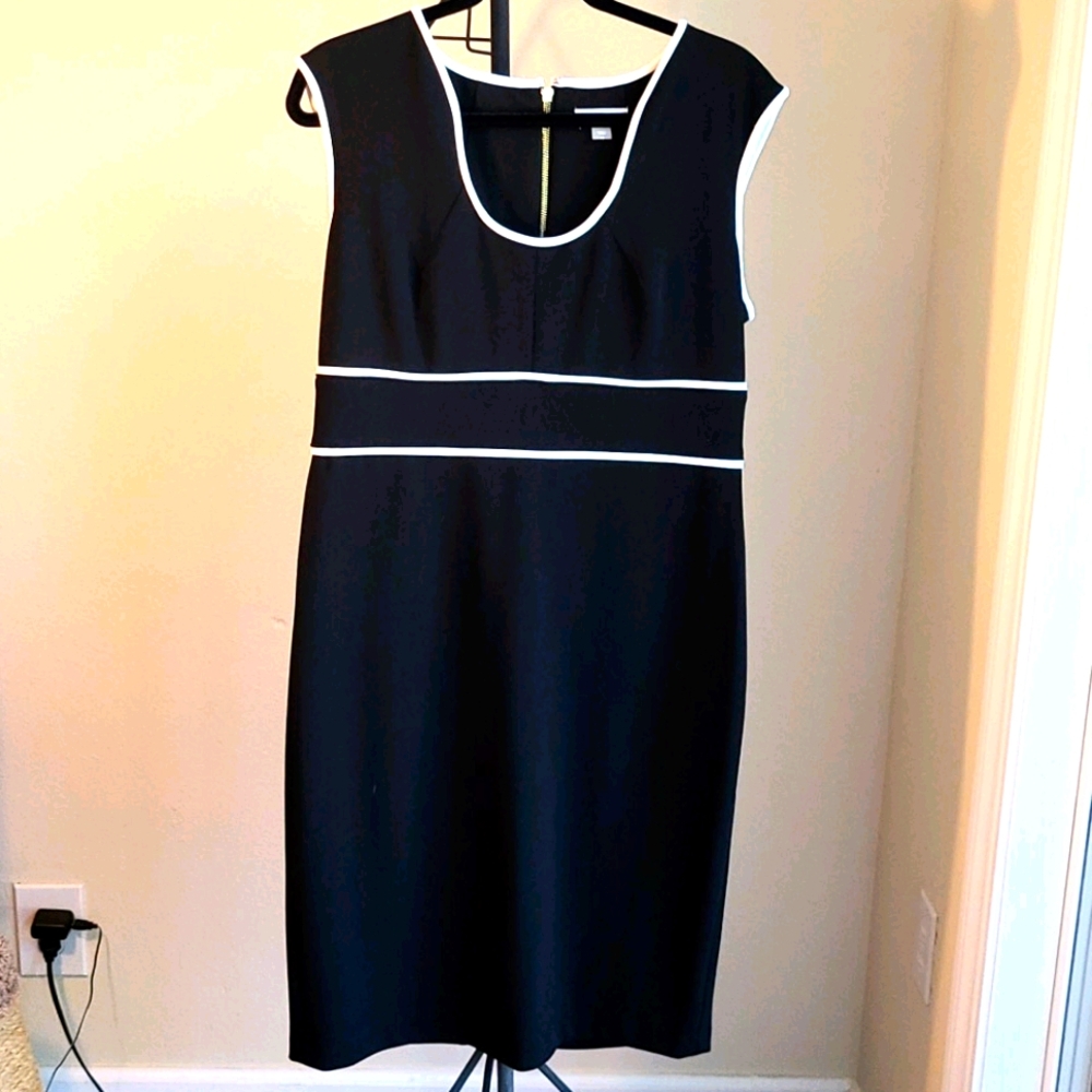 Flattering black dress with white piping